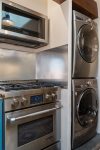 The kitchen features high-end designer appliances